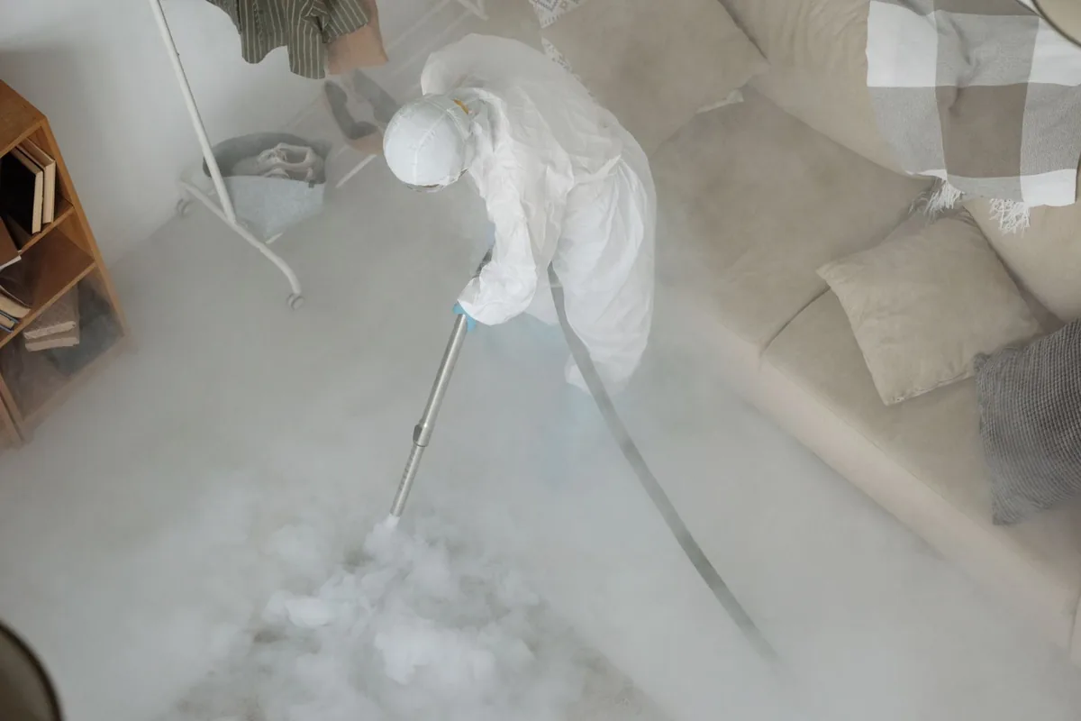 Biohazard cleanup technician in protective equipment, Rio, VA